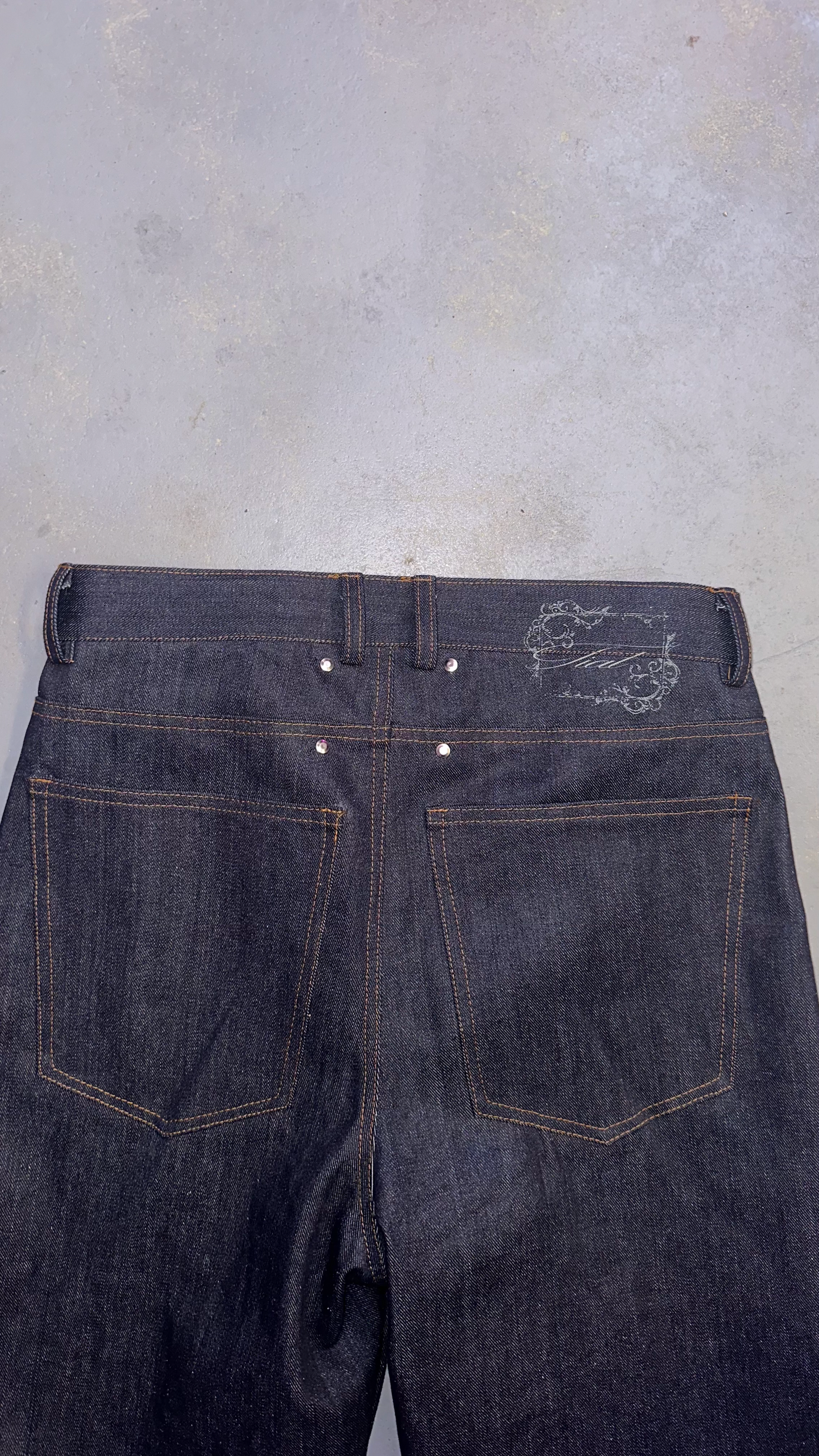 Laser raw denim bootcut