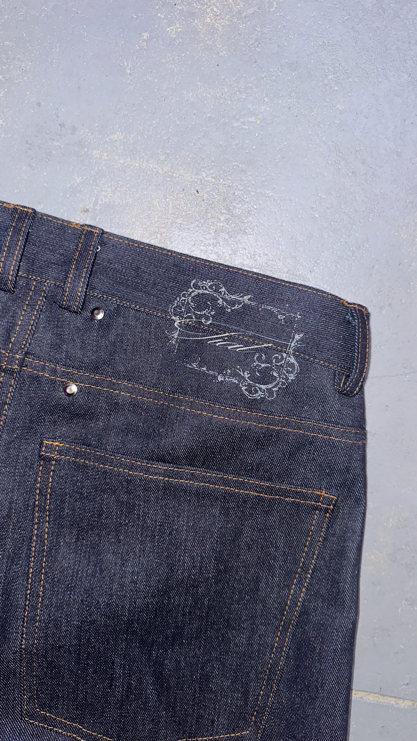 Laser raw denim bootcut